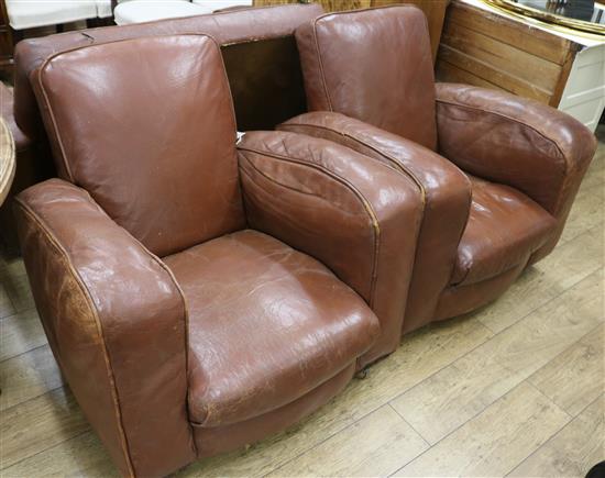 A pair of leather club armchairs